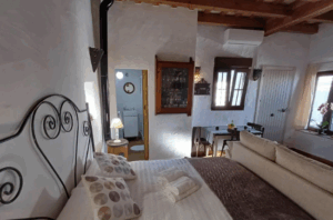 Chalet adosado en Vejer Dormitorio techo madera